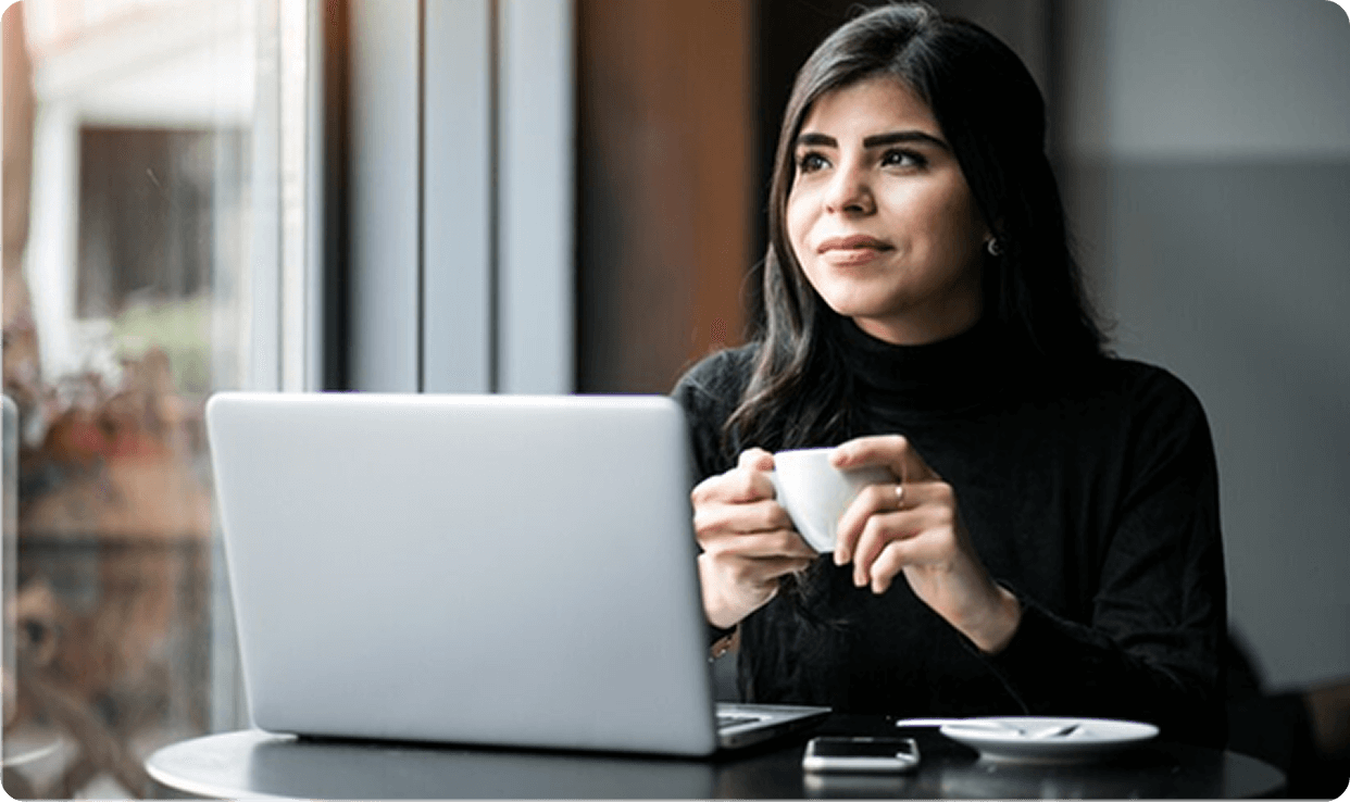 Woman with laptop and coffee